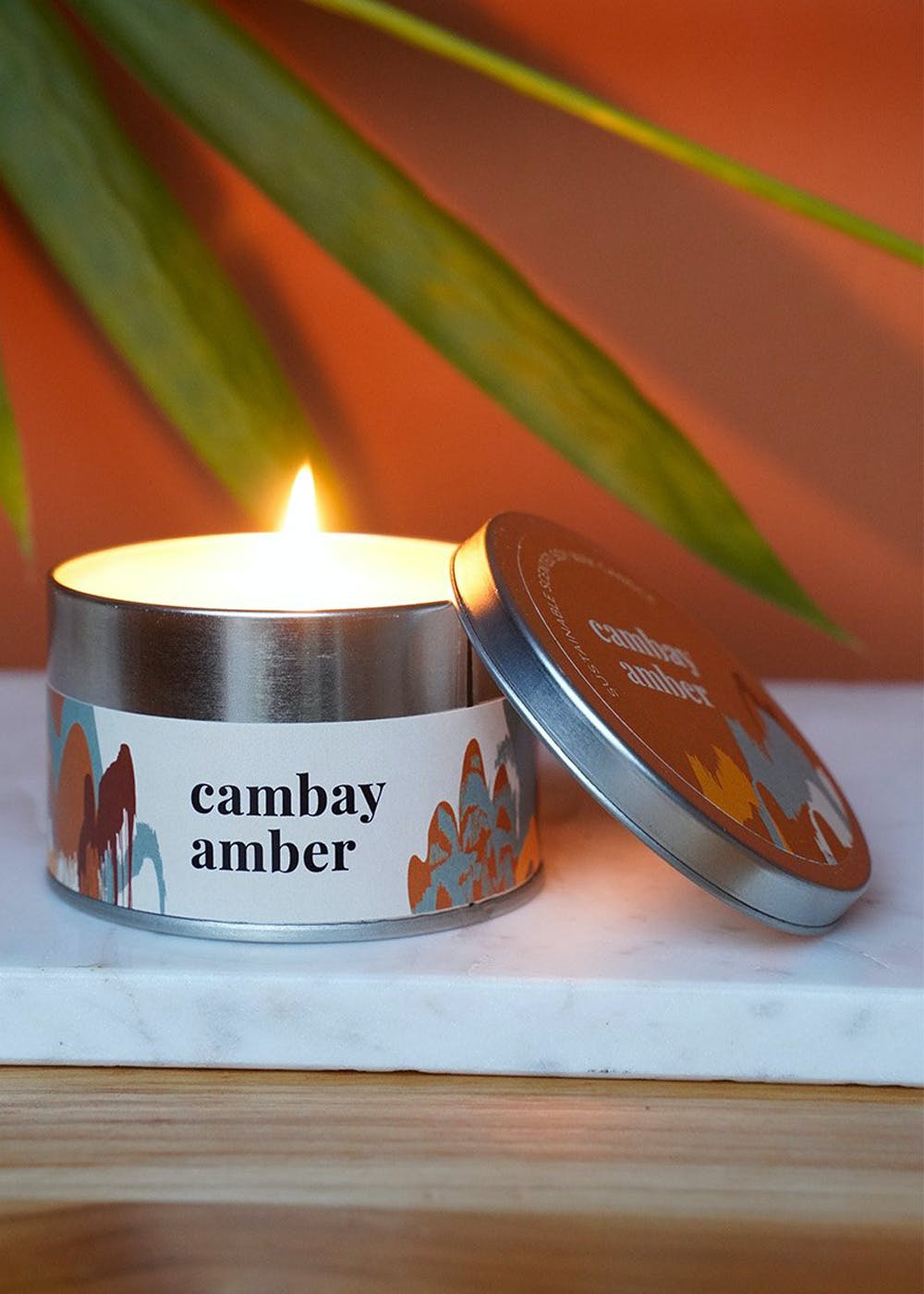 Get Dark Amber & Ginger Lily Scented Candle Tin Box at ₹ 980 LBB Shop