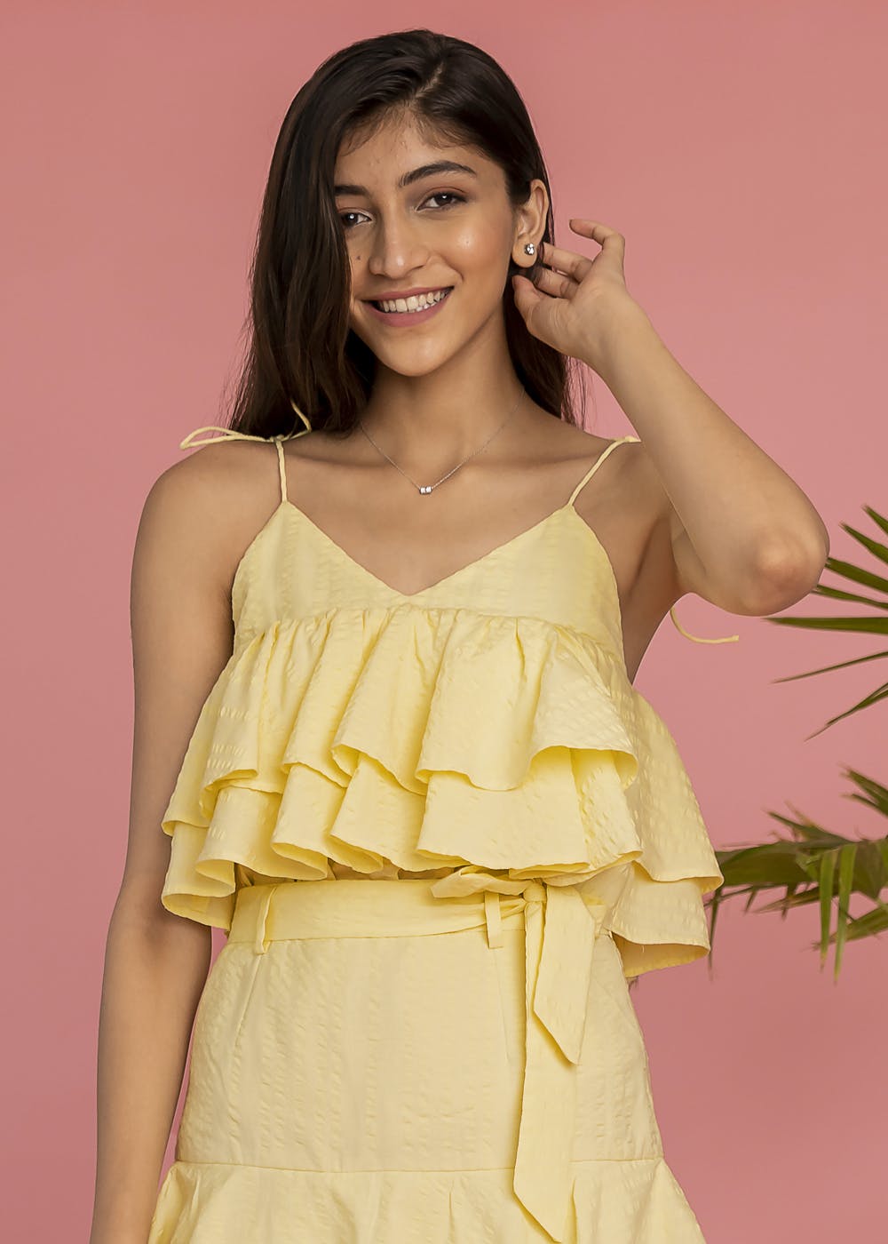 Get Ruffled Hem Detail Yellow Straapy Crop Top at ₹ 999 LBB Shop