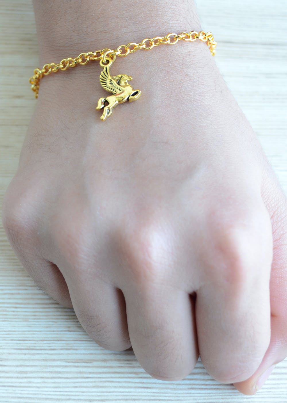 Premium Photo  Woman hand hold gold bracelet and necklace jewelry