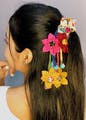 Hair,Hair accessory,Hairstyle,Yellow,Headpiece,Fashion accessory,Ear,Black hair,Headgear,Flower