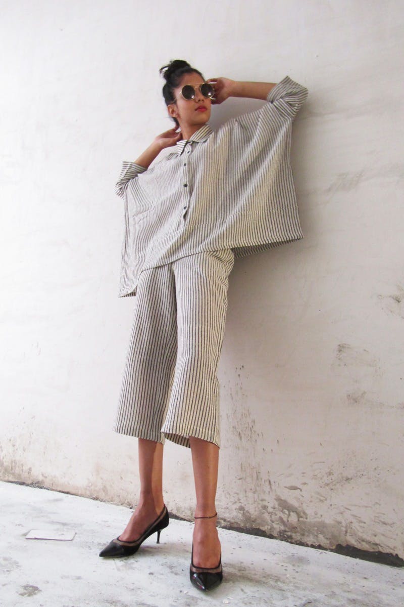 White,Clothing,Shoulder,Standing,Fashion,Dress,Outerwear,Joint,Leg,Footwear