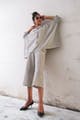 White,Clothing,Shoulder,Standing,Fashion,Dress,Outerwear,Joint,Leg,Footwear