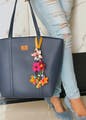 Handbag,Bag,Tote bag,Orange,Shoulder,Fashion accessory,Yellow,Shoulder bag,Material property,Luggage and bags