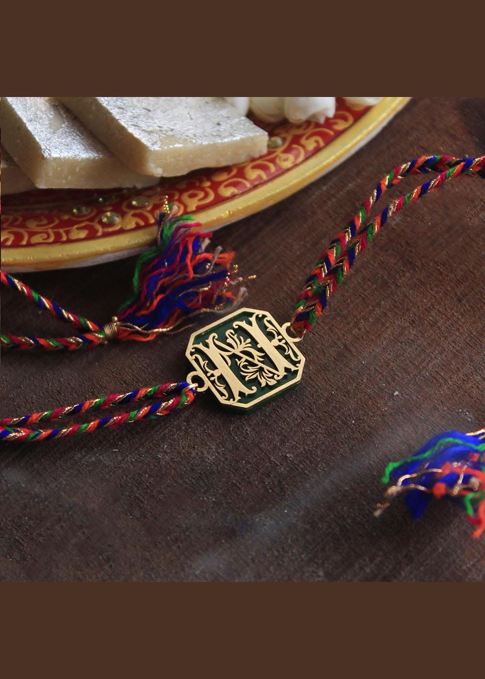Get Green Floral Initial Acrylic Rakhi at ₹ 400 | LBB Shop