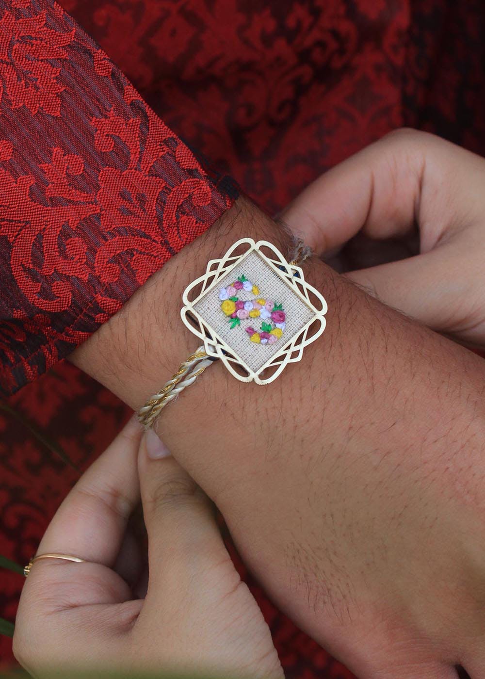 Get Blossomy Initial Embroidery Frame Rakhi at ₹ 500 LBB Shop