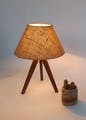 Lamp,Wood,Table,Chair,Headgear,Art,Tints and shades,Wicker,Trunk,Outdoor furniture