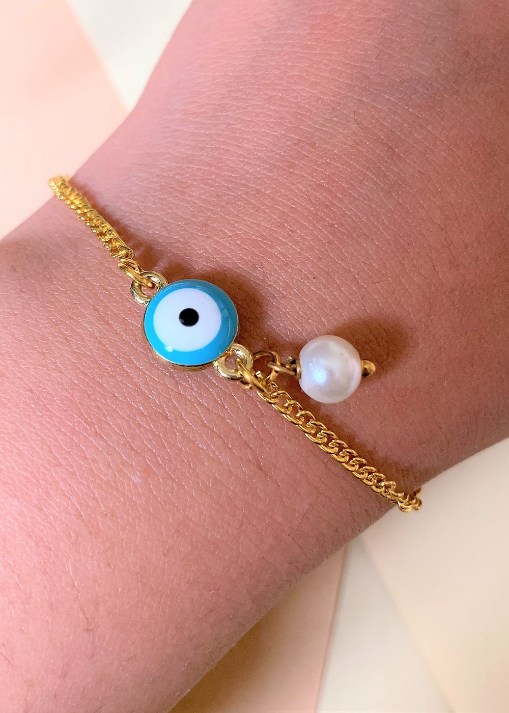 Get Blue Evil Eye Gold Plated Bracelet With Pearl Drop at ₹ 499 LBB Shop