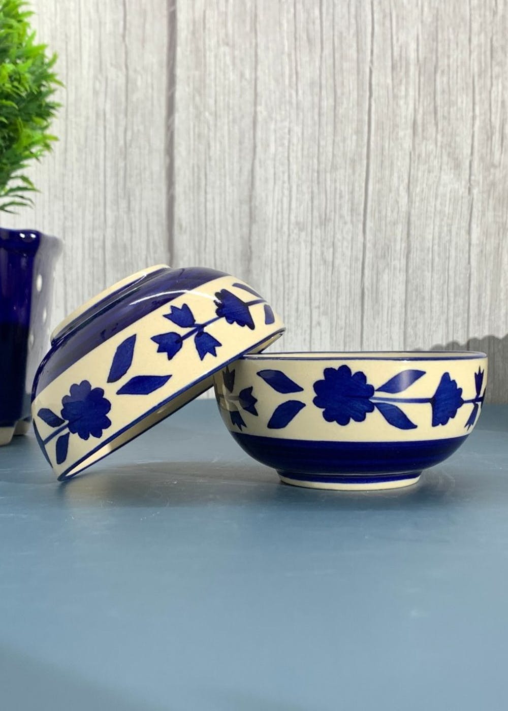 white and blue ceramic bowl