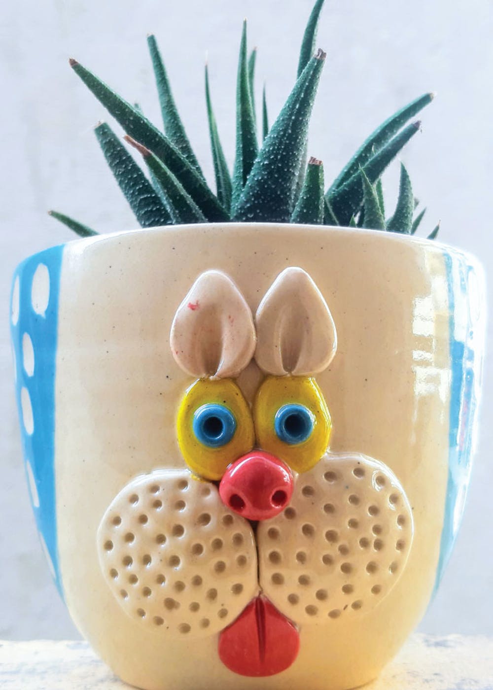 Drinkware,Headgear,Fawn,Costume hat,Font,Hat,Toy,Stuffed toy,Art,Eyewear