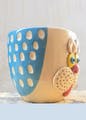 Drinkware,Art,Toy,Cup,Creative arts,Serveware,Font,Electric blue,Plastic,Pottery