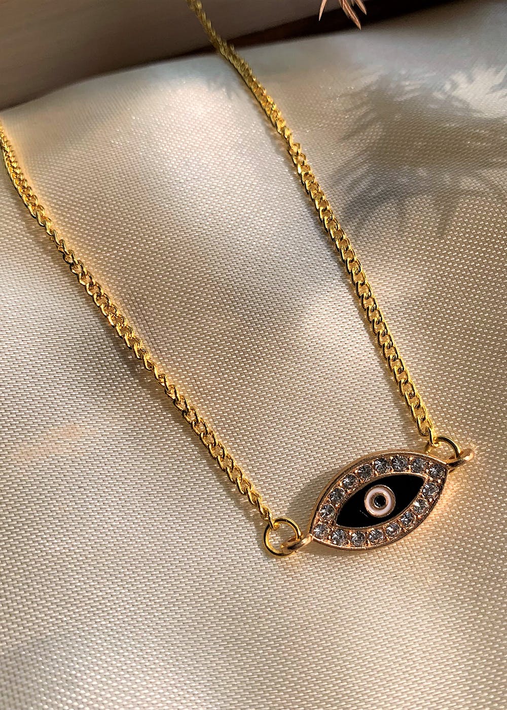 Heart shaped evil eye necklace in gold plating -