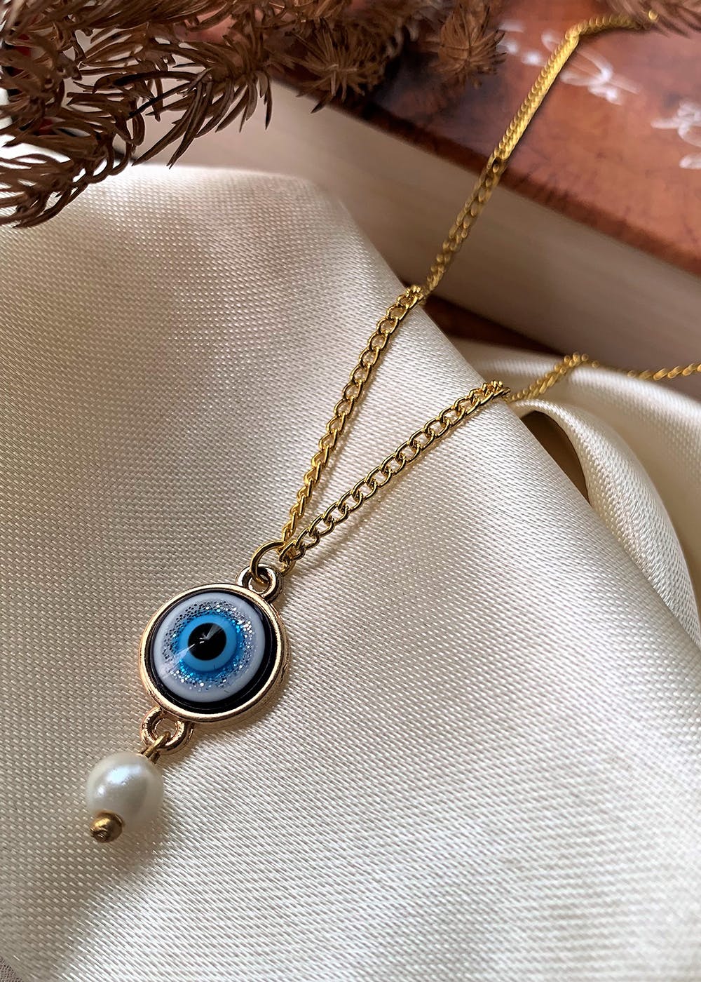 Get Gold Plated Evil Eye Pendant With Pearl Drop And Chain at ₹ 799