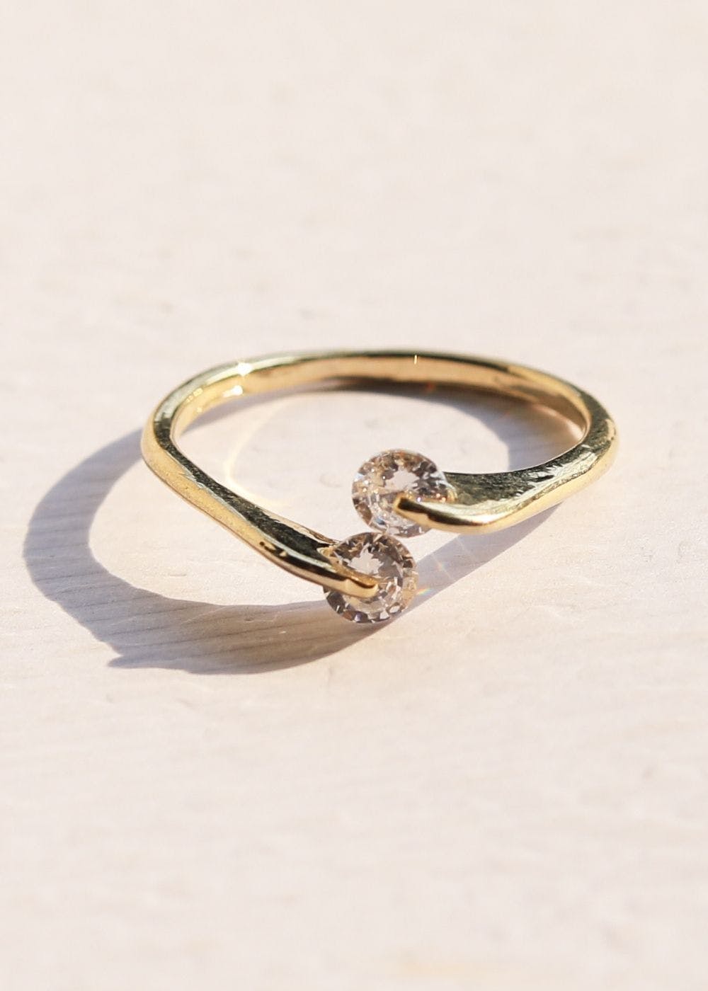 Premium Photo | Captivating close up shot of two wedding rings delicately  intertwined to symbolize the everlasting bond of love and commitment jewelry  gold diamond ring for anniversary valentine or engagement