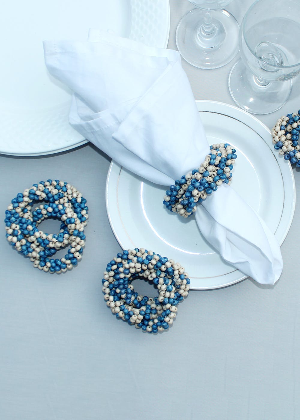 Get Blue And Cream Wooden Napkin Ring Set Of 4 at ₹ 449 LBB Shop