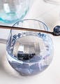 Drinkware,Hood,Liquid,Blue,Automotive lighting,Stemware,Barware,Perfume,Aqua,Serveware