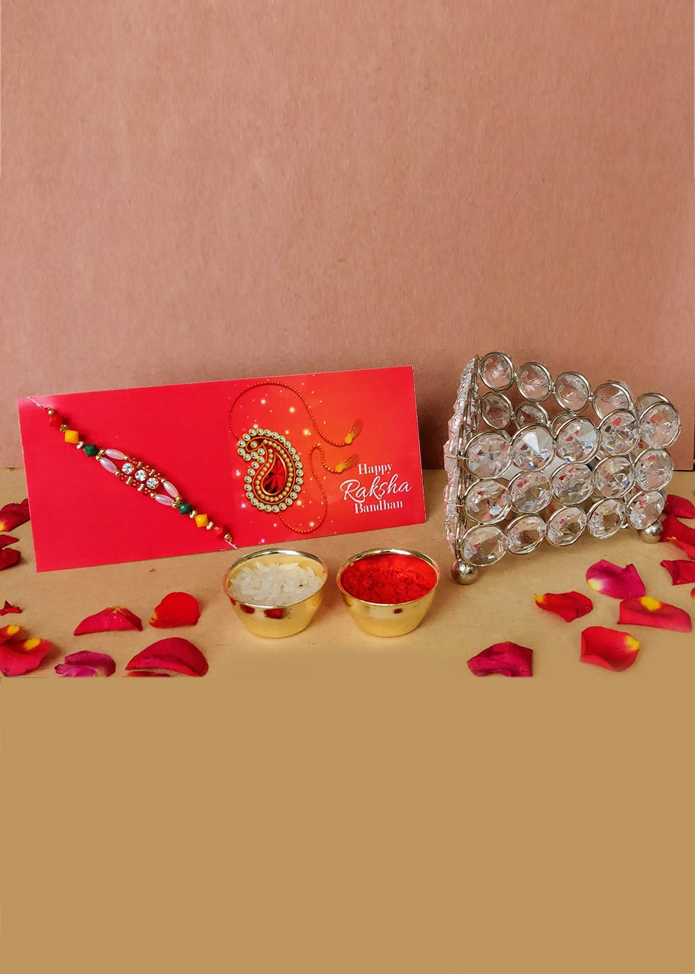 Get Rakhi With Crystal Triangle Candle Stand Gift Set at ₹ 499 LBB Shop