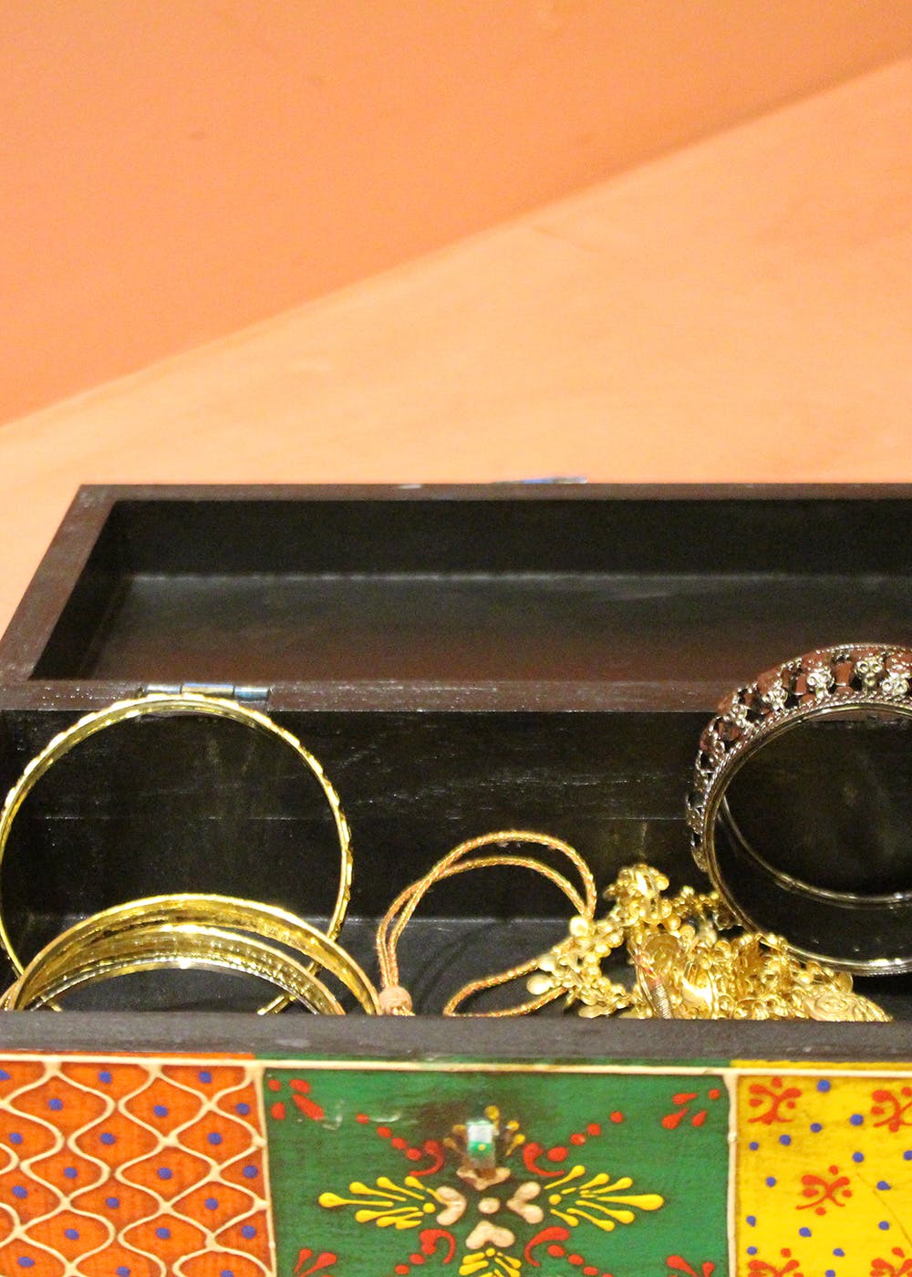Gold,Rectangle,Amber,Jewellery,Art,Metal,Pattern,Natural material,Fashion accessory,Flower