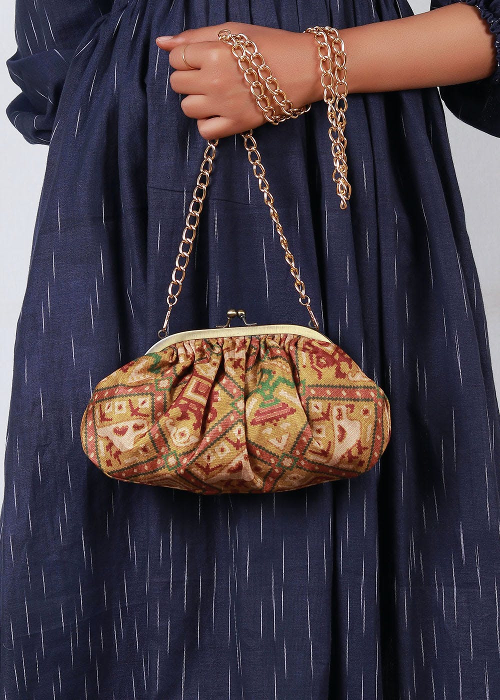Multi coloured Patola print Silk Potli