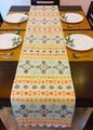 Table,Tablecloth,Textile,Rectangle,Decoration,Yellow,Interior design,Floor,Line,Flooring